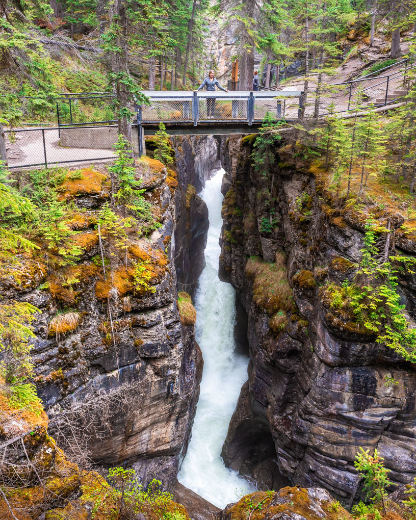 Bailey standing on the second bridge at Maligne canyon in Jasper, Canada