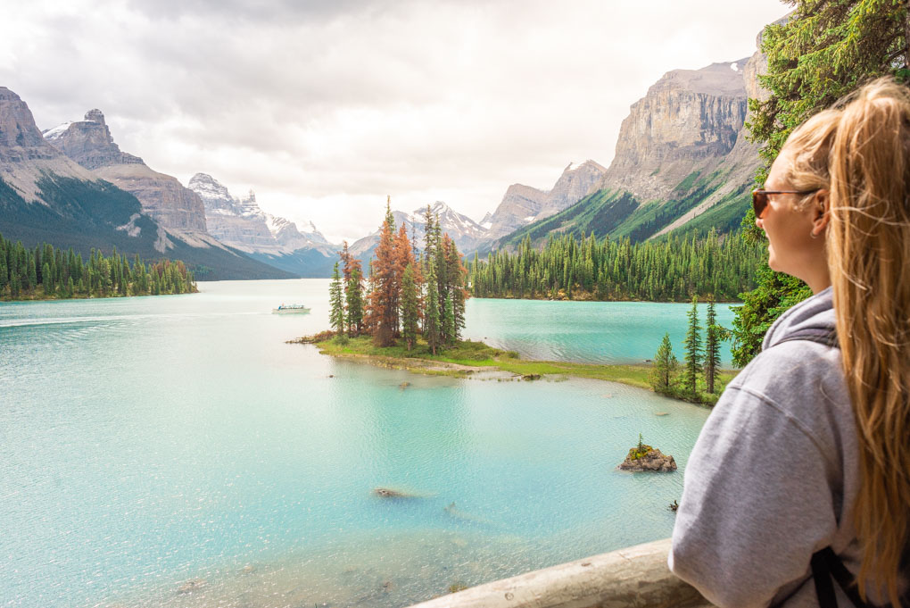 A lady looks over at Spirit island from the viewpoint visited on the maligne Lake cruise
