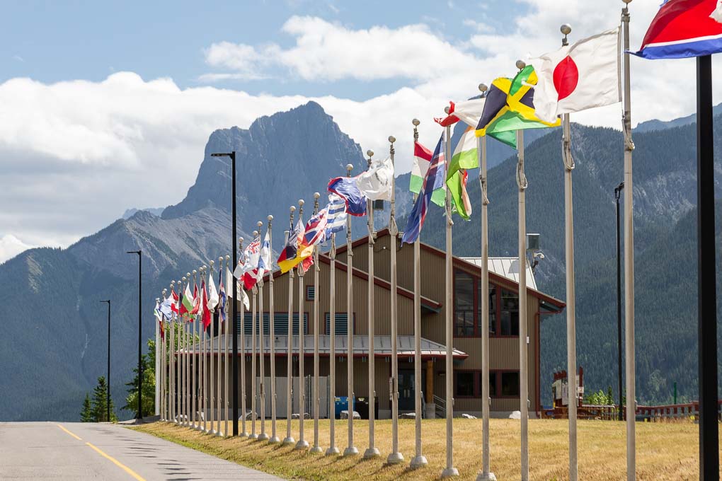 The country flags from the olimpic games held at the Nordic Center in Canmore