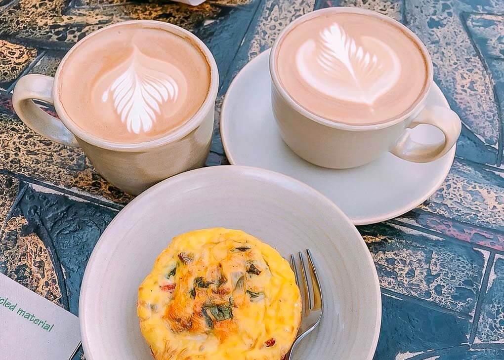 Two coffees and a muffin at Good Earth Café in Canmore