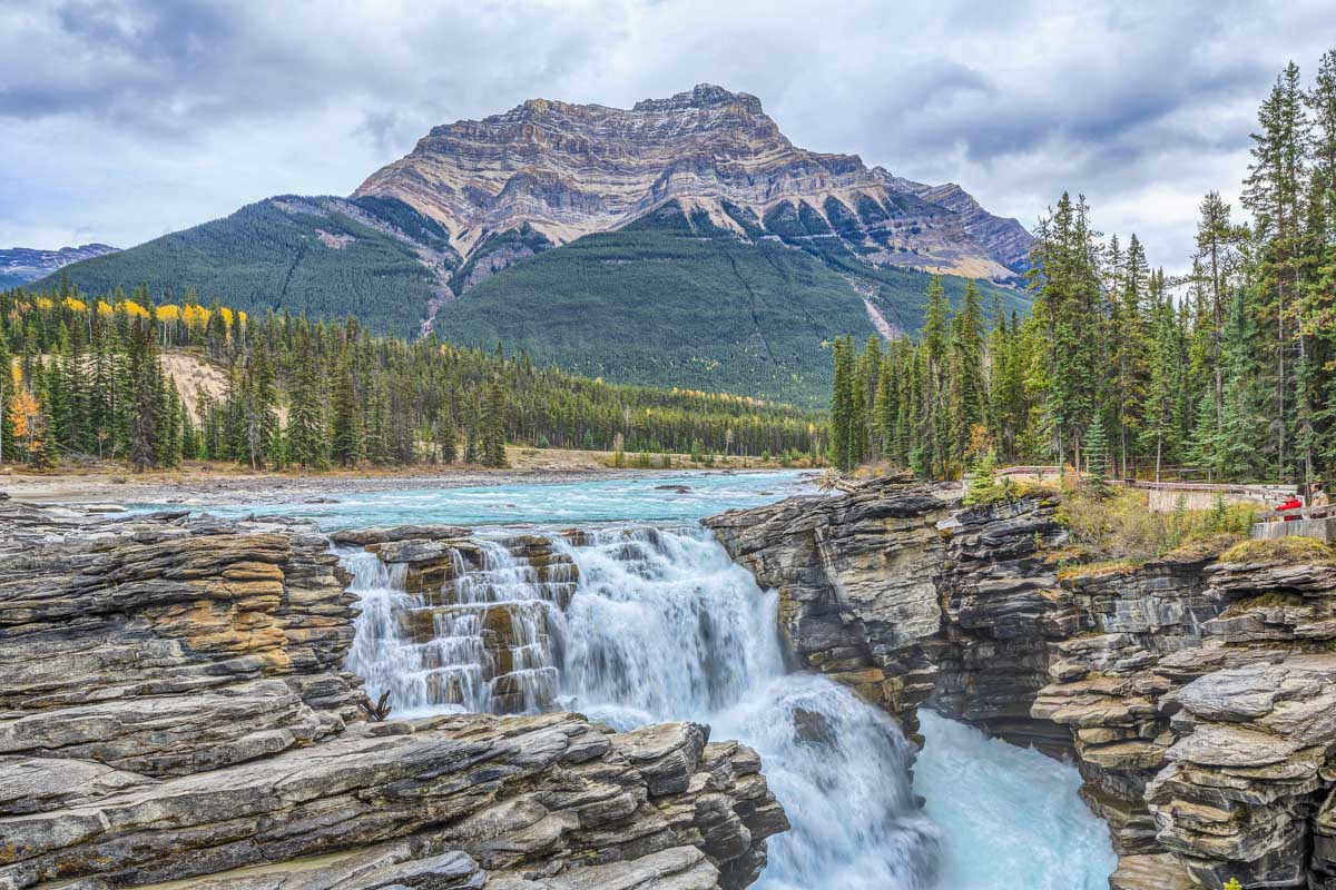 Athabasca Falls with a huge mountain in the background in Jasper national Park