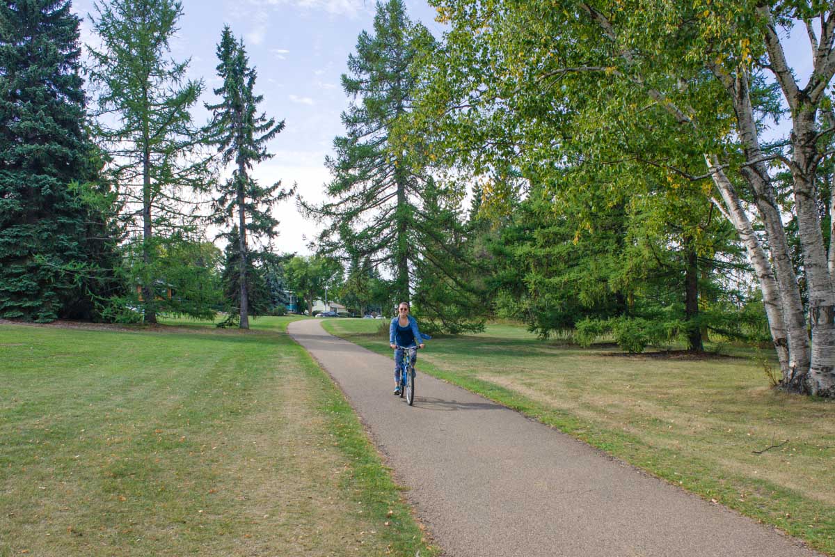 Bailey riding a bicycle in Invermere. BC along a paved path