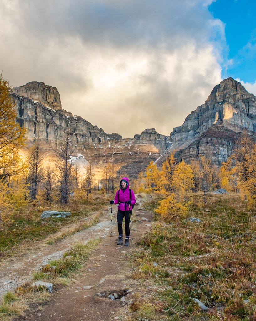A lady hiking on the Larch Valley Trail