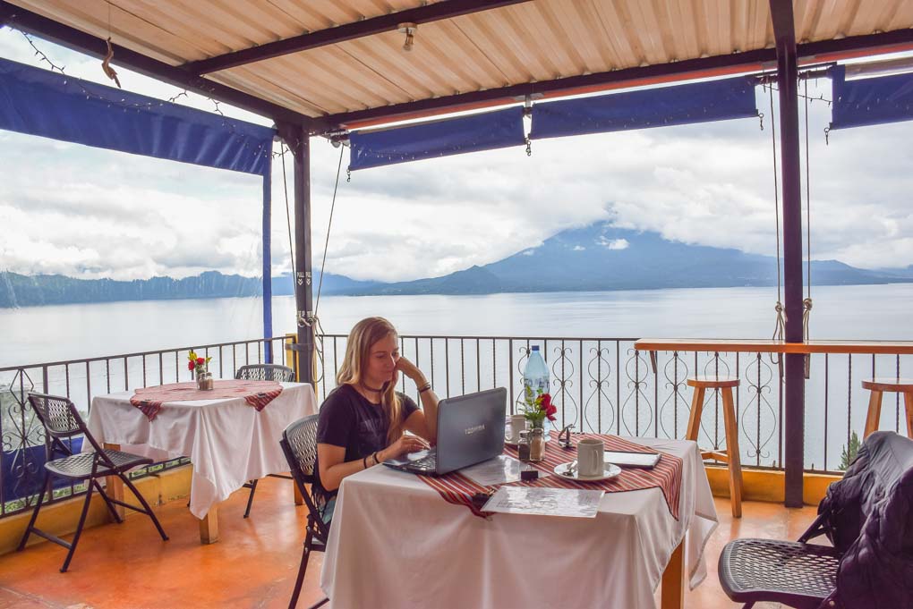 bailey working while she waits for lunch at a cafe in lake atitlan