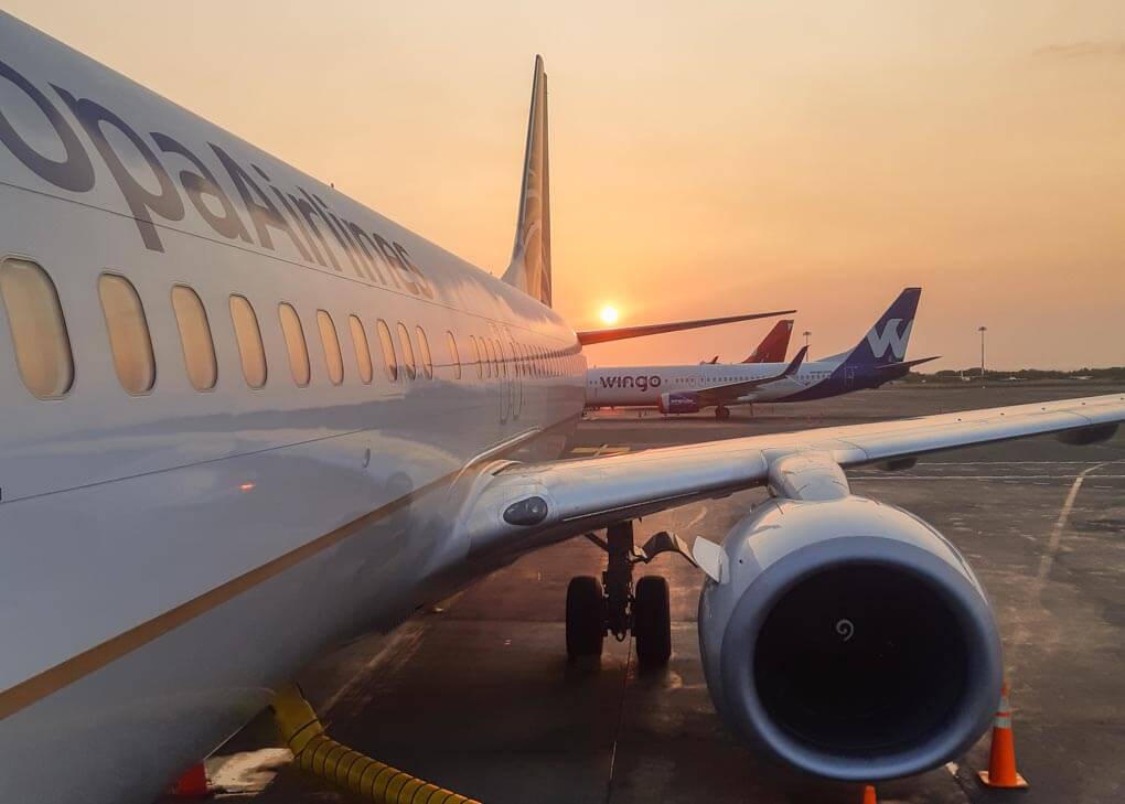 boarding an airplane at sunrise