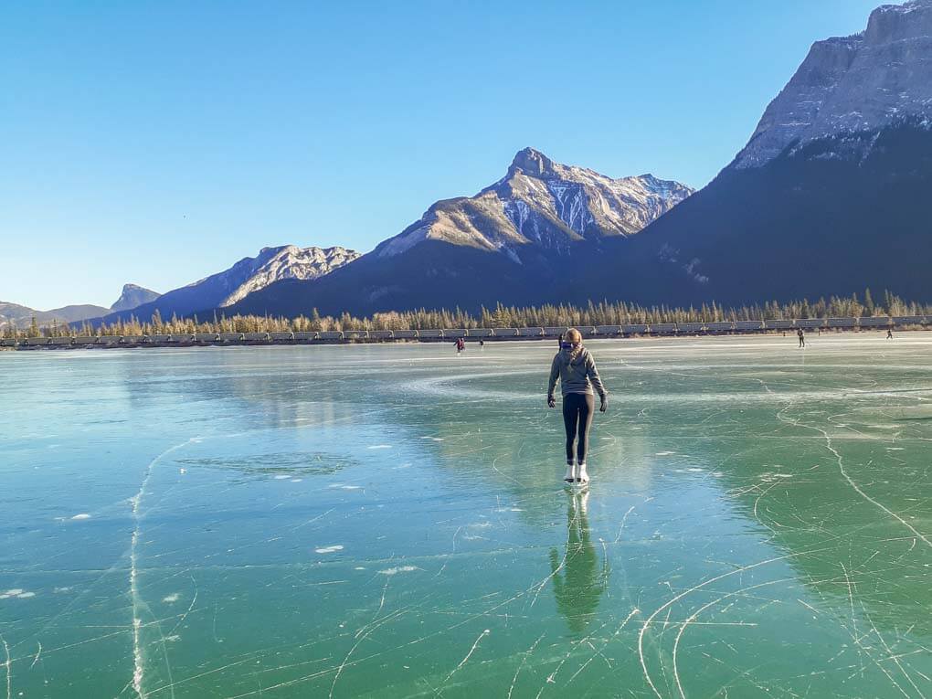 A lady skates at Gap Lake, Canmore