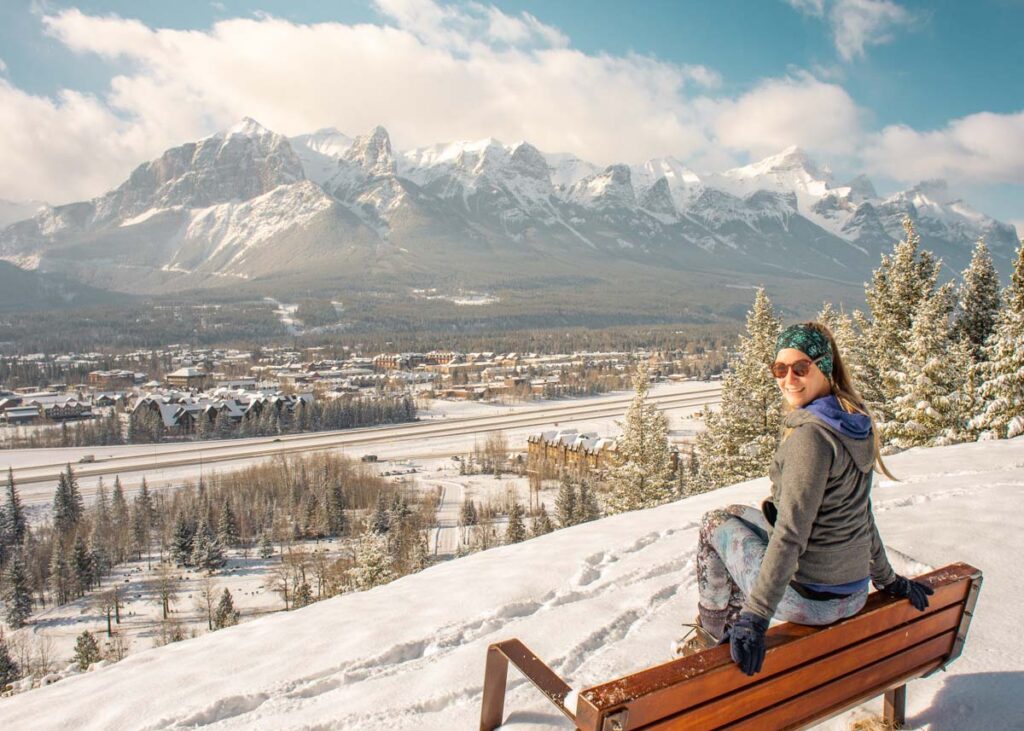 Woman at a viewpoint in Canmore in the winter