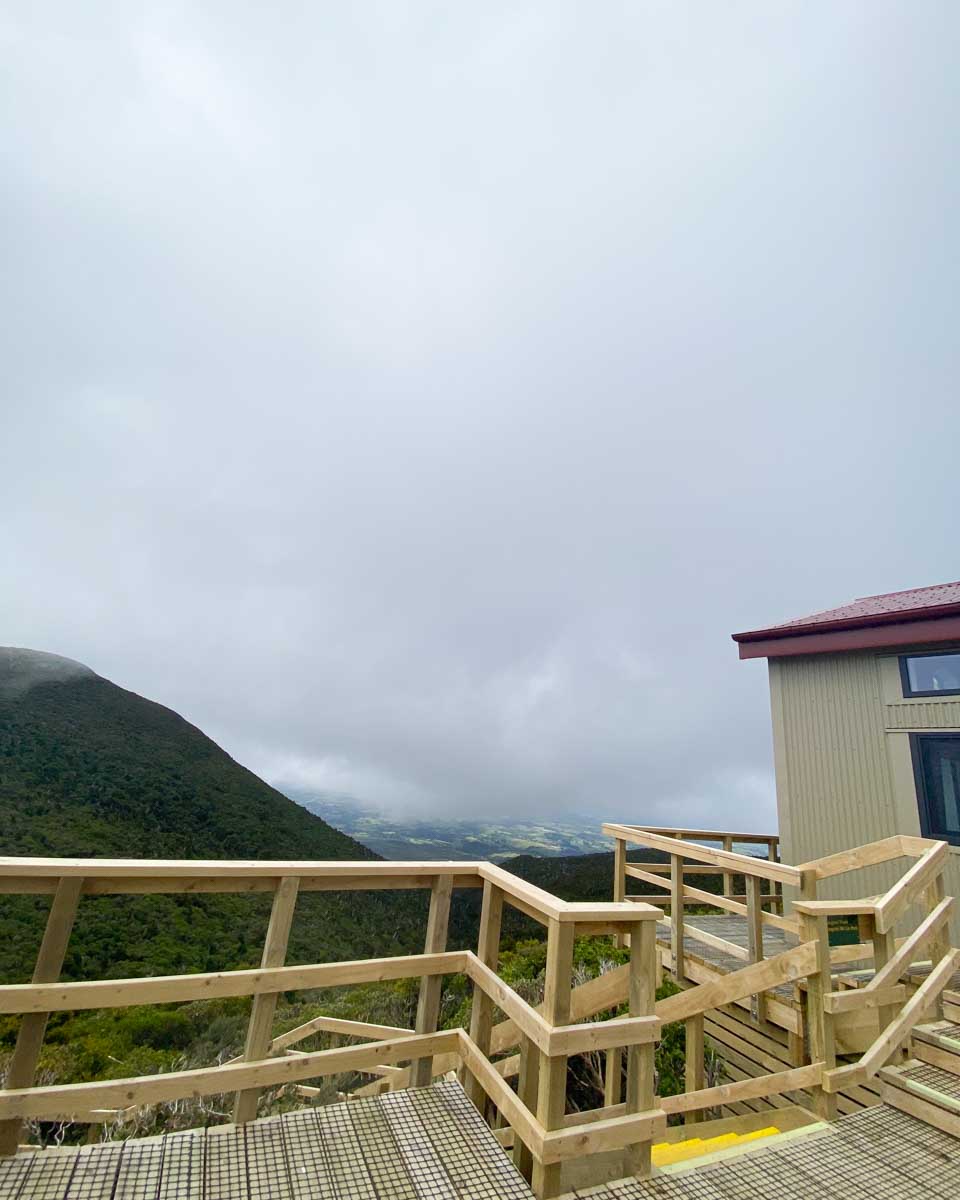 The outside of the Pouakai Hut on a cloudy day