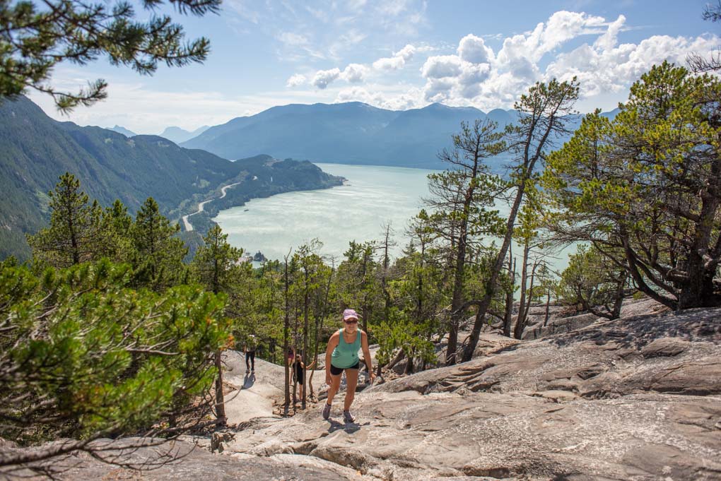 A lady walks up the Stawamus Chief track in Vancouver, BC