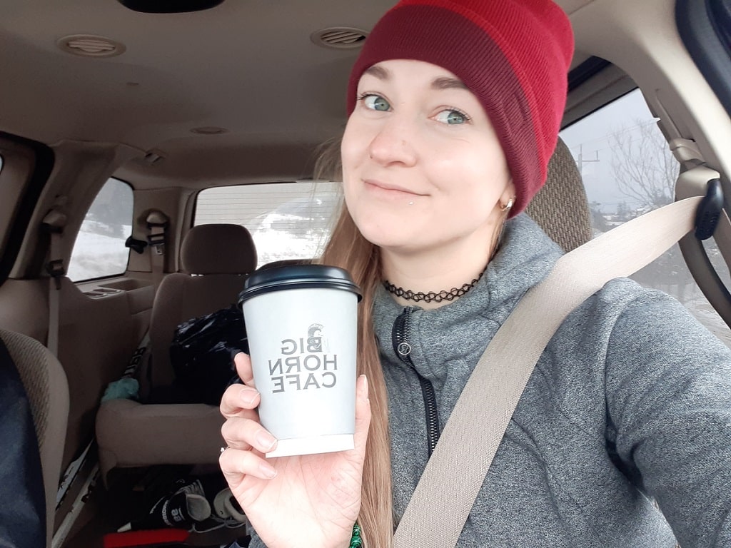 drinking-coffee-from-big-horm-cafe-in-radium-bc-min