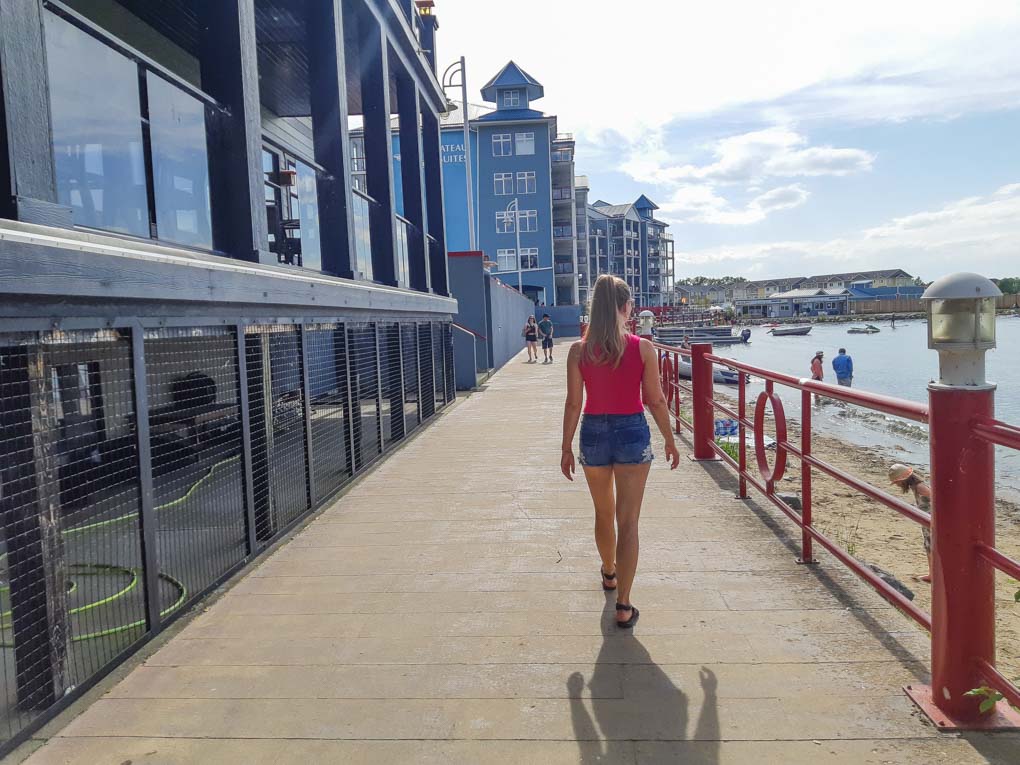 woman wlaking the marina in Sylvan Lake, Alberta