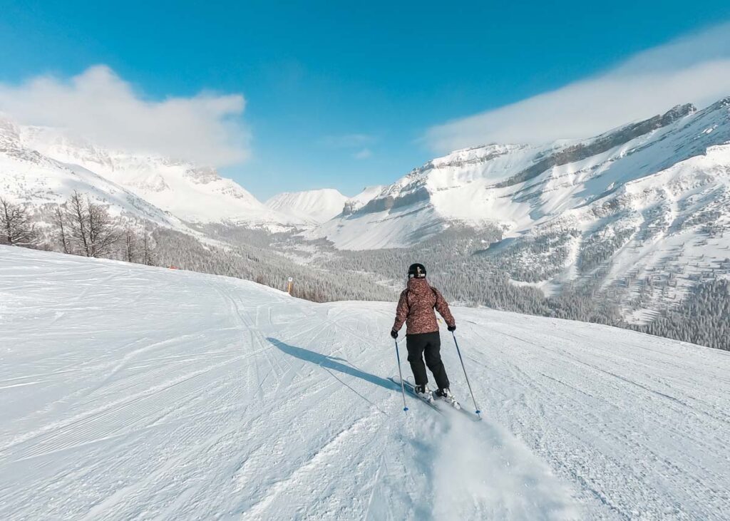 a lady skis at Lake Louise Ski Resort