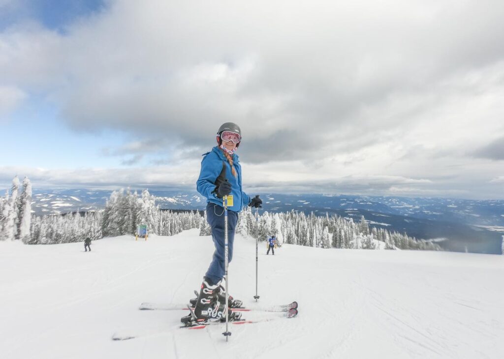 Bailey from Destinationless Travel on a ski hill in Canada
