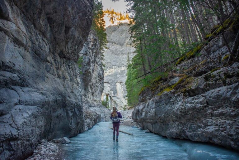 Hiking through a the frozen Grotto Canyon in winter