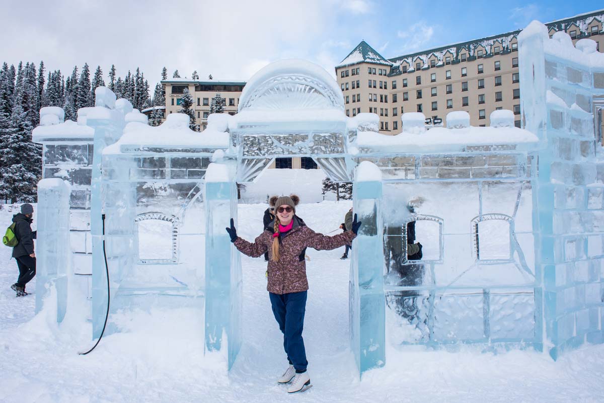 A lady poses for a photo at the Lake Louise Ice sculptures