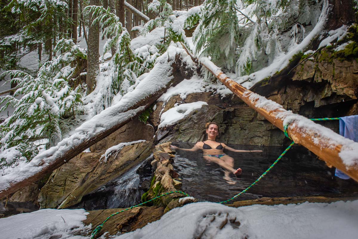 A lady relaxes in St Leon Hot Springs near Revelstoke, BC
