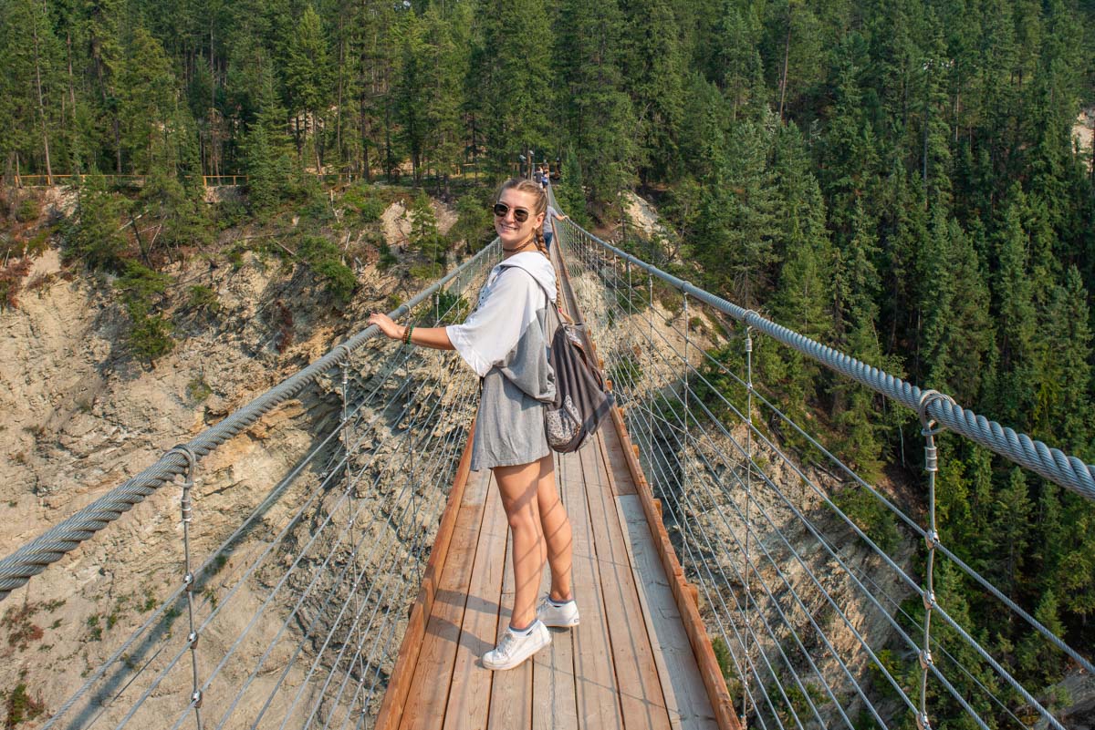 Vailey from Destinationless Travel walks along the Golden Sky Bridge