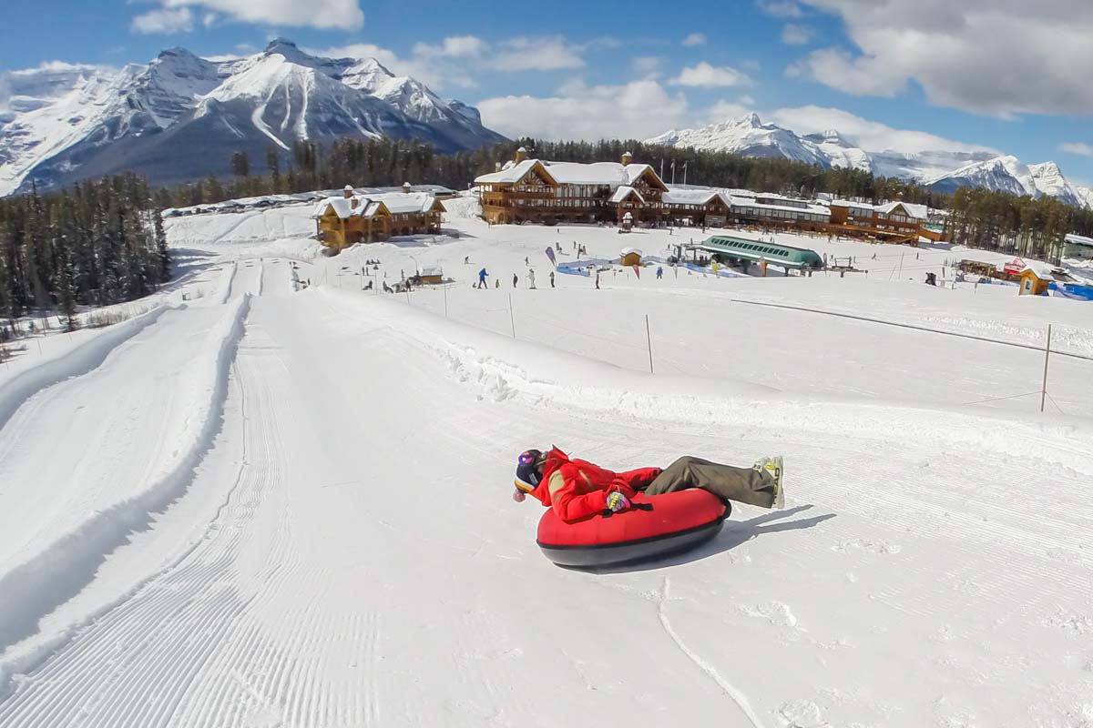 A kid slides down the Lake Louise Tube Park