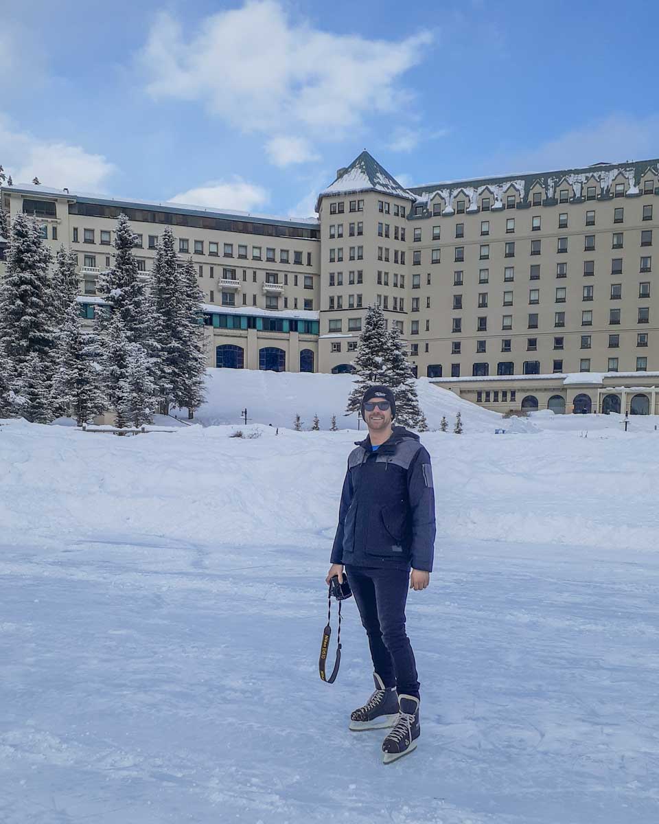 Daniel in hockey skates on the outdoor rink at Lake Louise