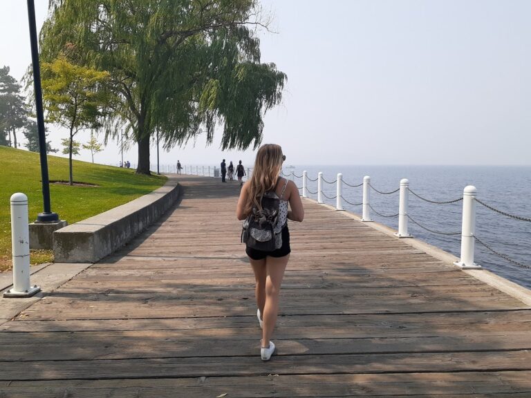 woman walking the boardwalk in Kelowna, BC