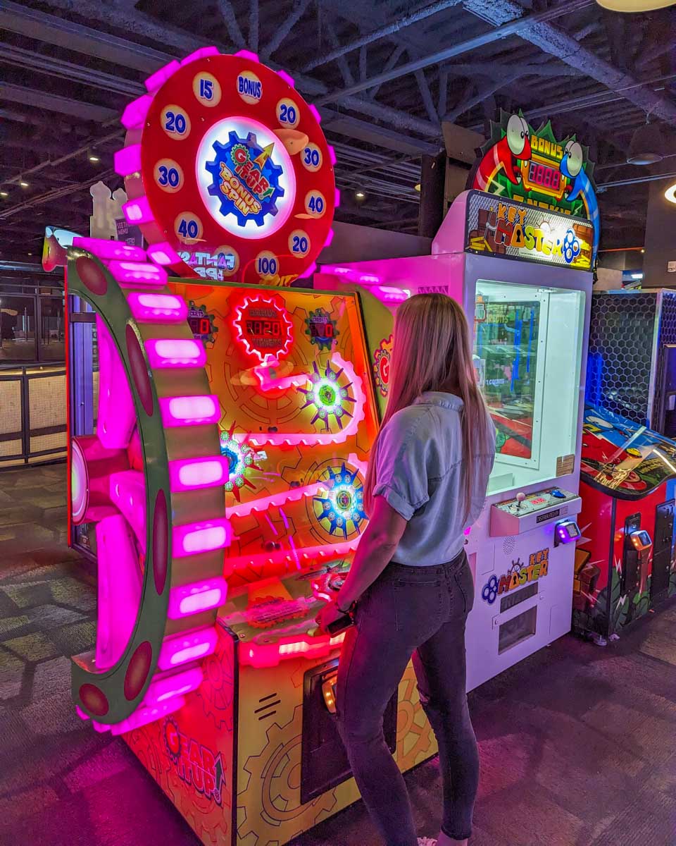 Bailey plays a game at The Rec Room in the West Edmonton Mall, Edmonton