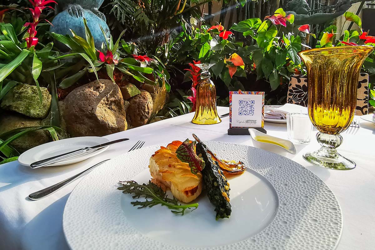 Meal in the garden at Cafe des Artistes