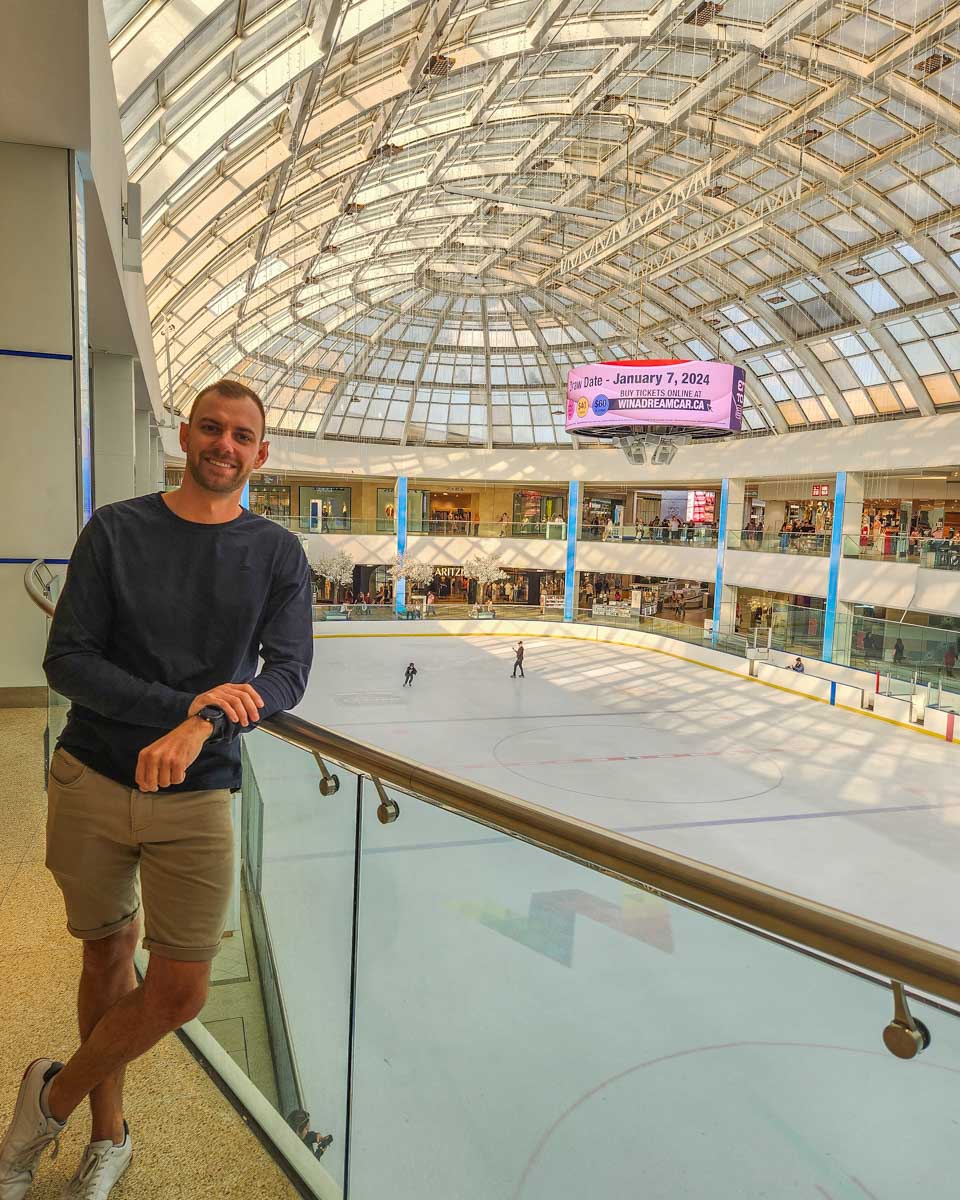 Daniel poses for a photo above the West Edmonton mall ice rink
