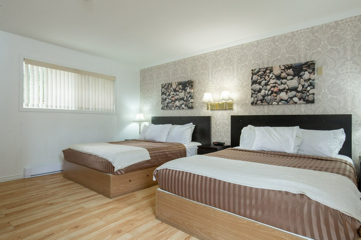 Two queen beds in Riverside Resort hotel room