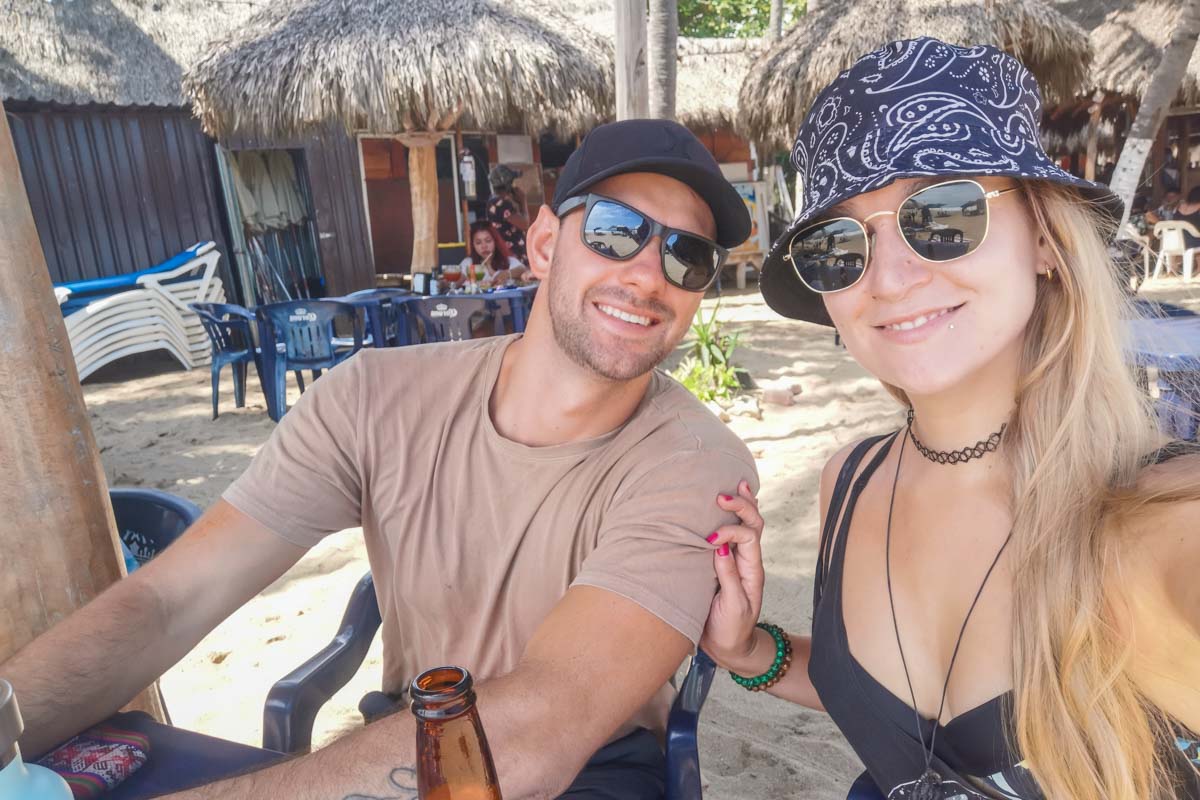 Dan and Bailey from Destinationless Travel take a selfie on San Pancho Beach, Mexico