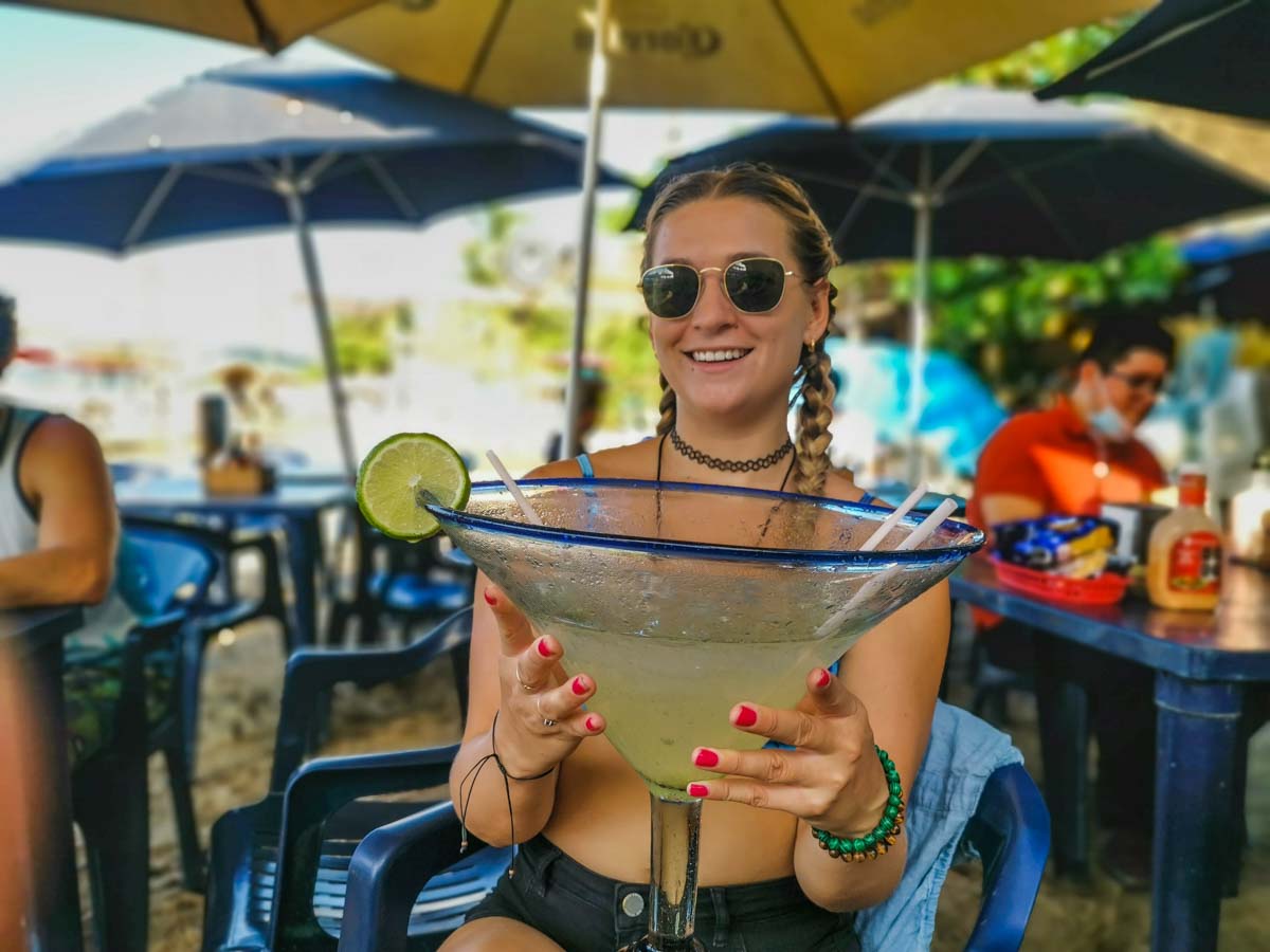 Bailey drinks a huge cocktail in Sayulita, Mexico