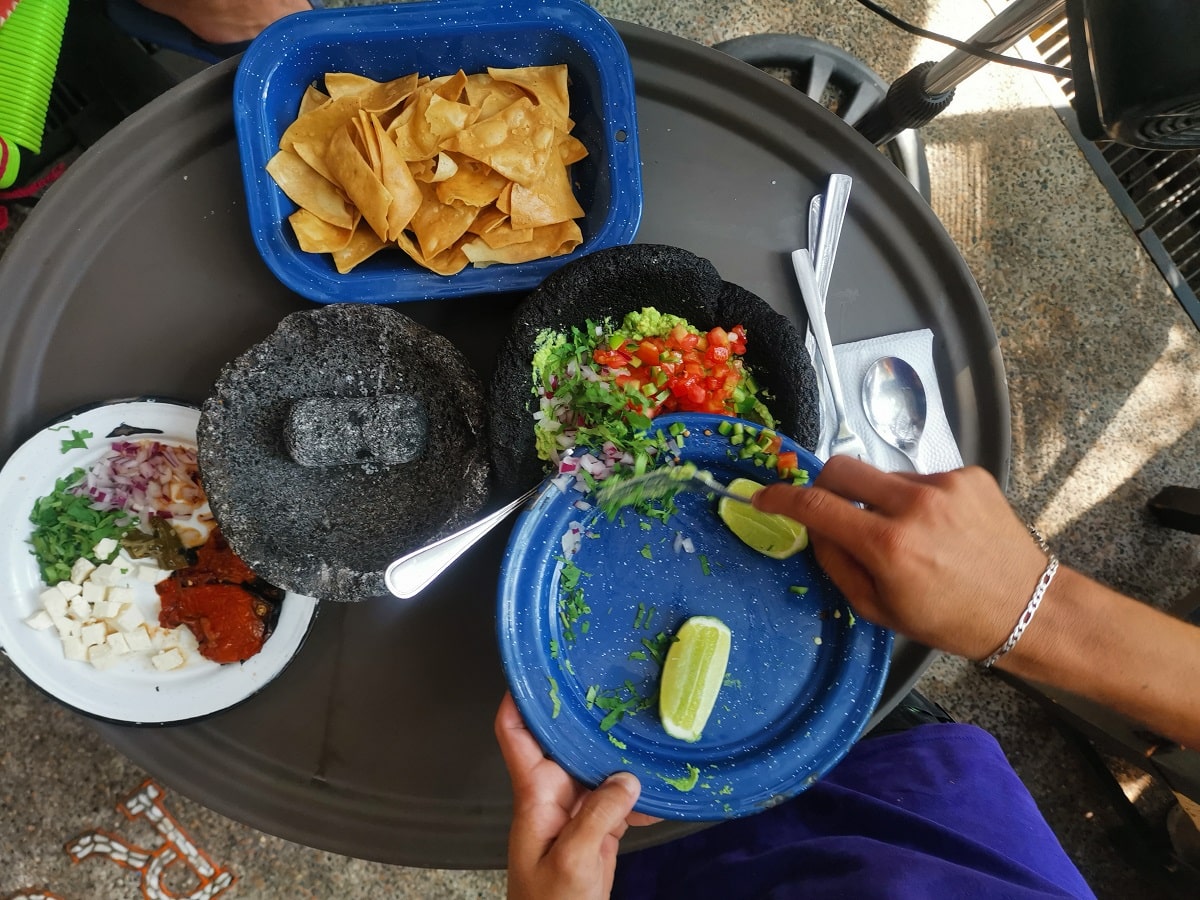 waiter making guacamole at the Margarita Grill in Puerto Vallarta