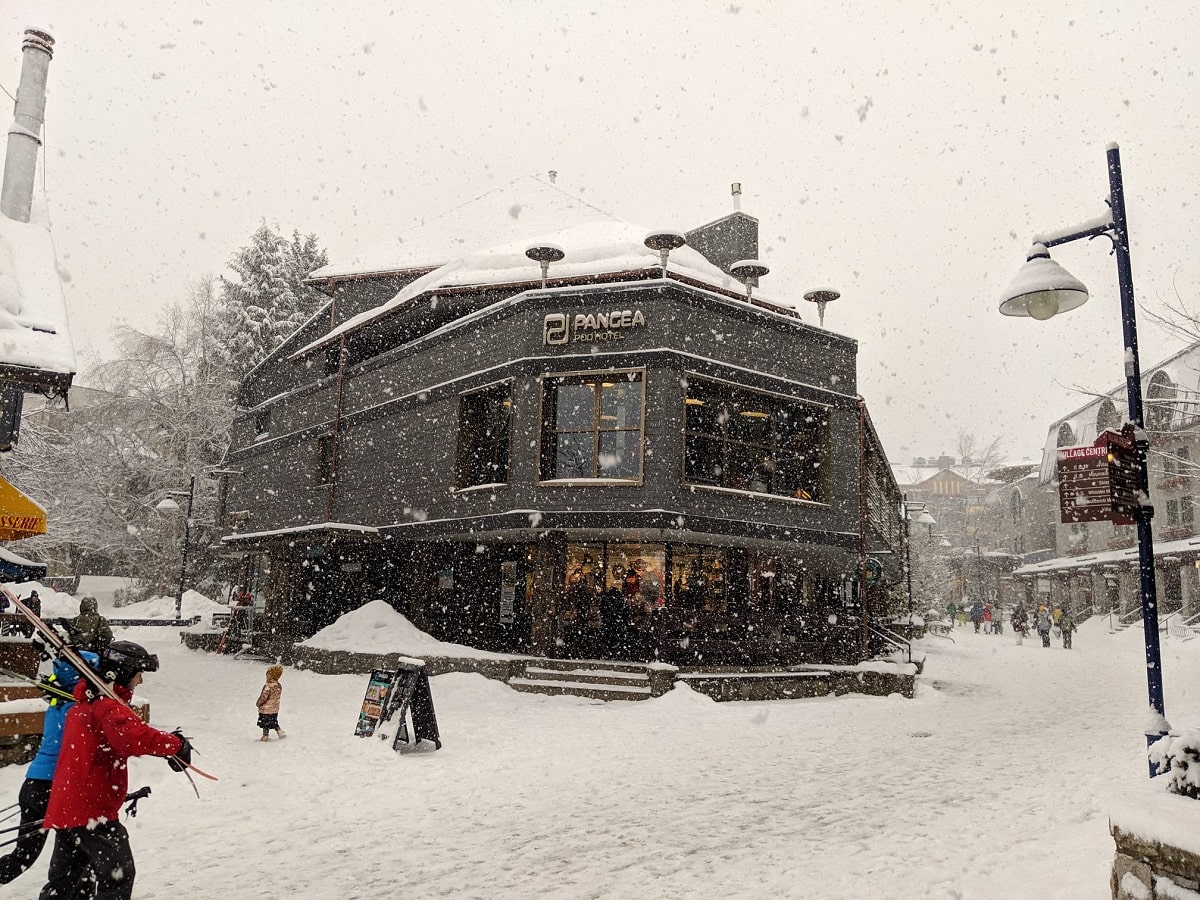 the outside of Pangea Pod Hotel in the winter in Whistler