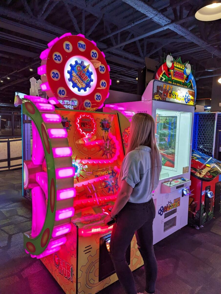 Bailey plays one of the arcade games in the Rec Room in Edmonton