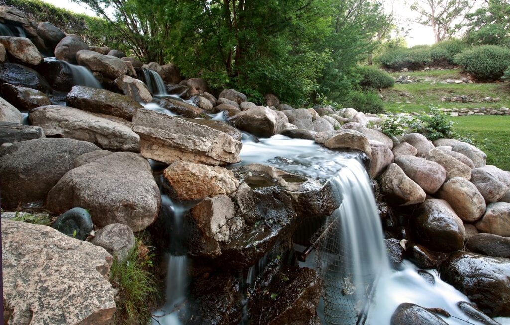 a small waterfall in Crescent Park in Moose Jaw
