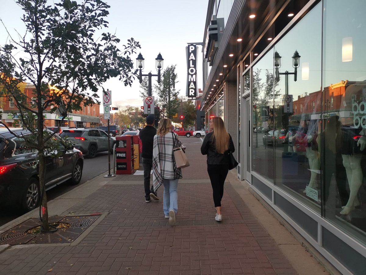 two women walking along Whyte Ave in Edmonton