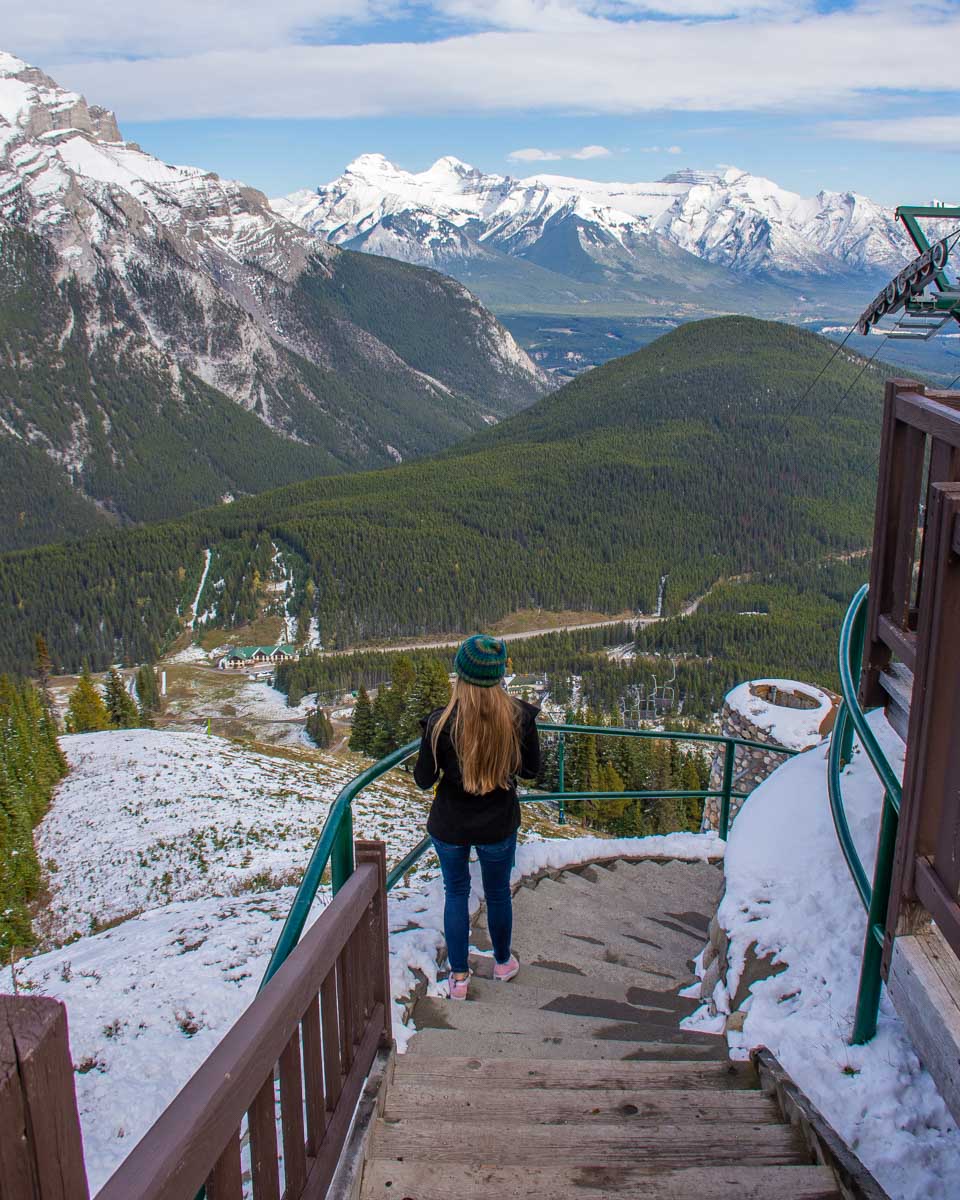 Bailey walks down some steps at the top of the Mt Norquay Chairlift