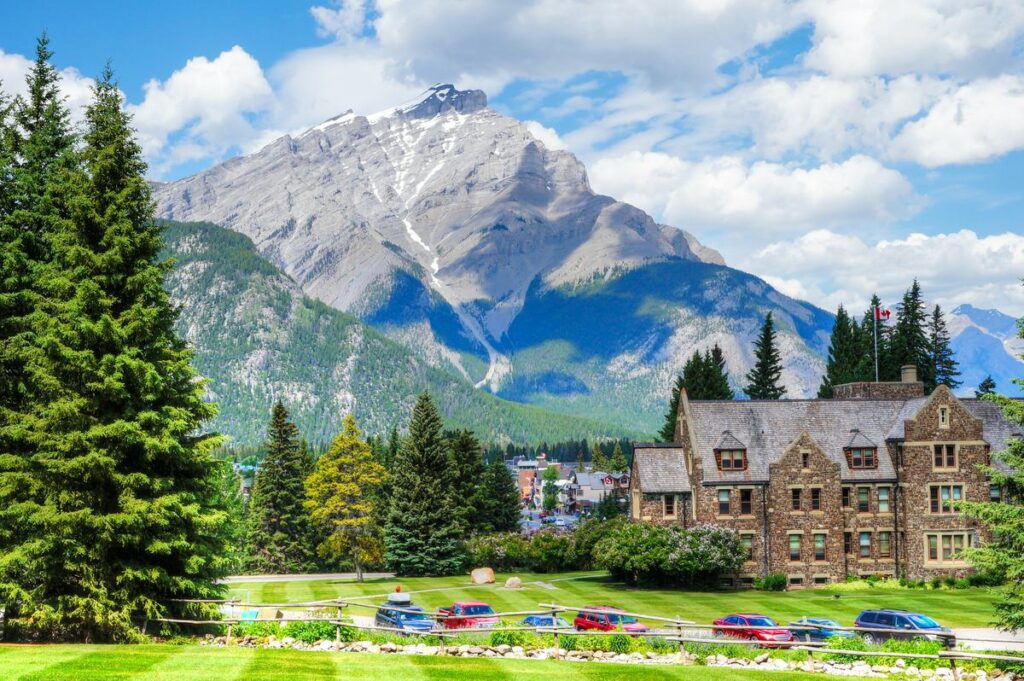 Cascade Mountain as seen from Cascades of Time Gardens at Banff National Park with the historic Parks Canada admin building in the foreground.