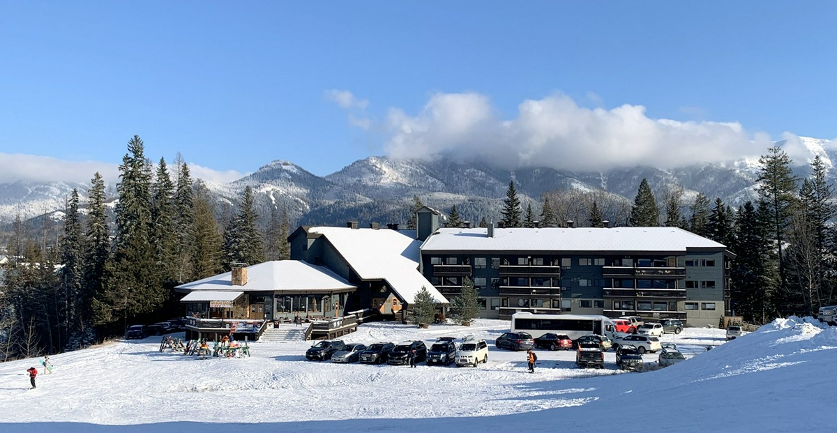 The Griz Inn by Park Vacation Management topped with snow during a winter day