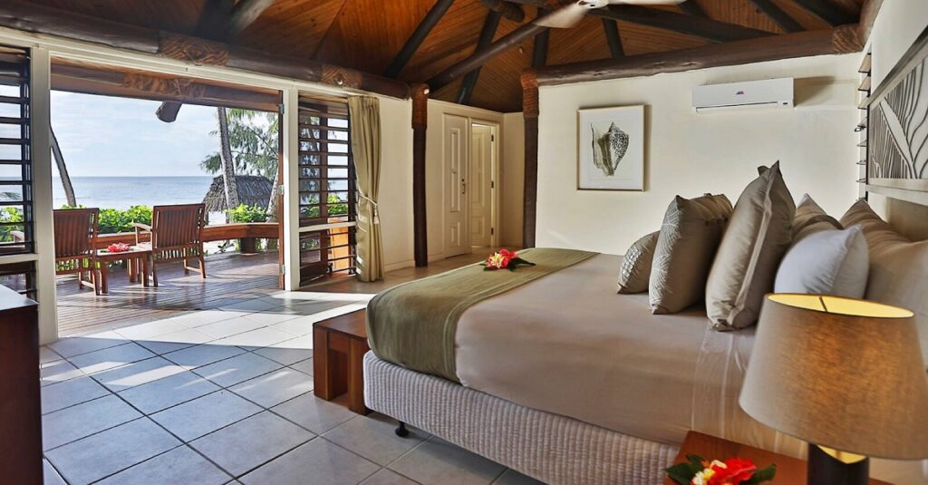 room and bed with ocean views at Yasawa Island Resort & Spa