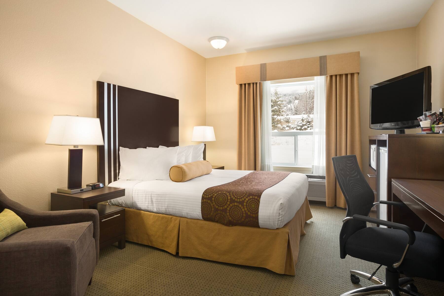 Ramada Limited queen suite bedroom in Lethbridge