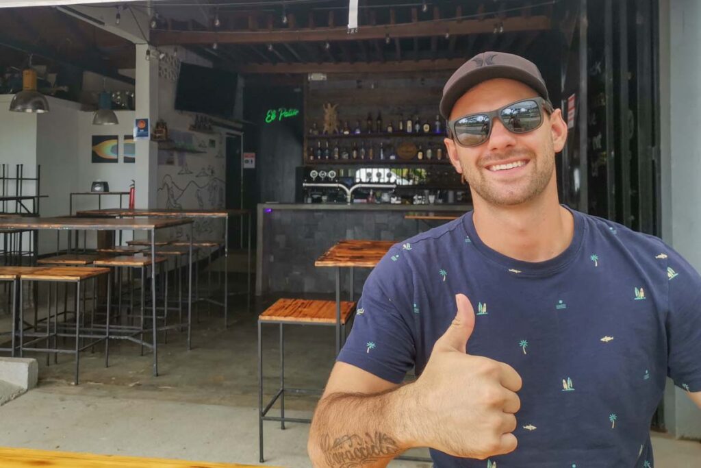 Posing for a photo at Whale Tail Brewery in Uvita