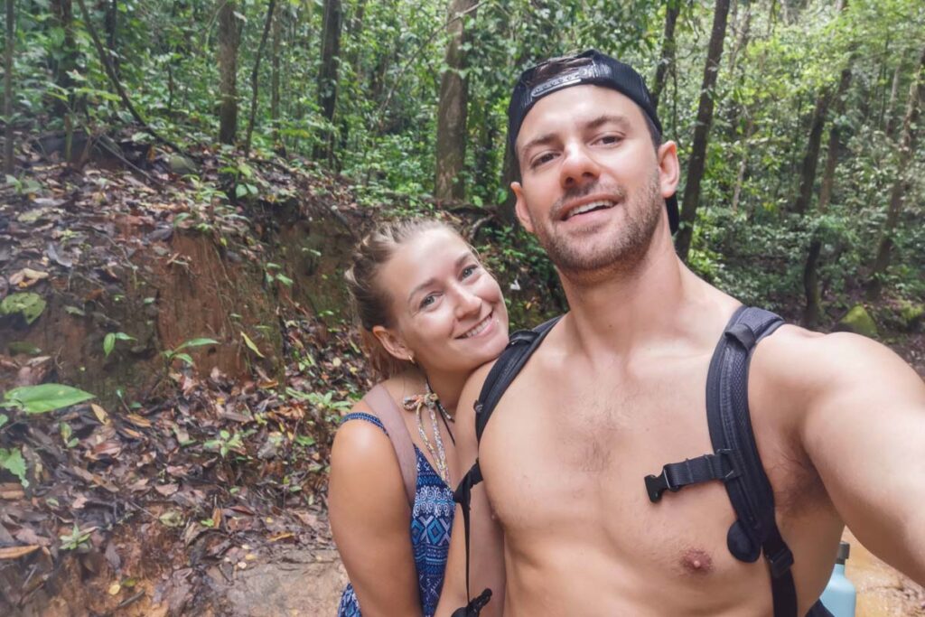 Daniel and Bailey from Destinationless Travel take a selfie at Nauyaca Waterfalls