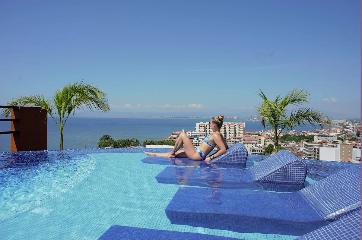 woman relaxing at a rooftop pool in Puerto Vallarta
