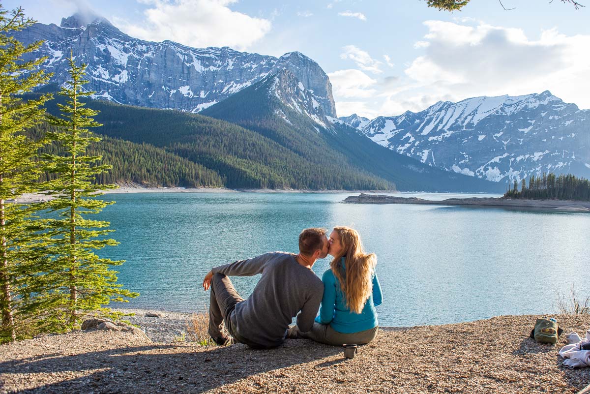 A couple pose for a photo at Upper Kananaskis Lake