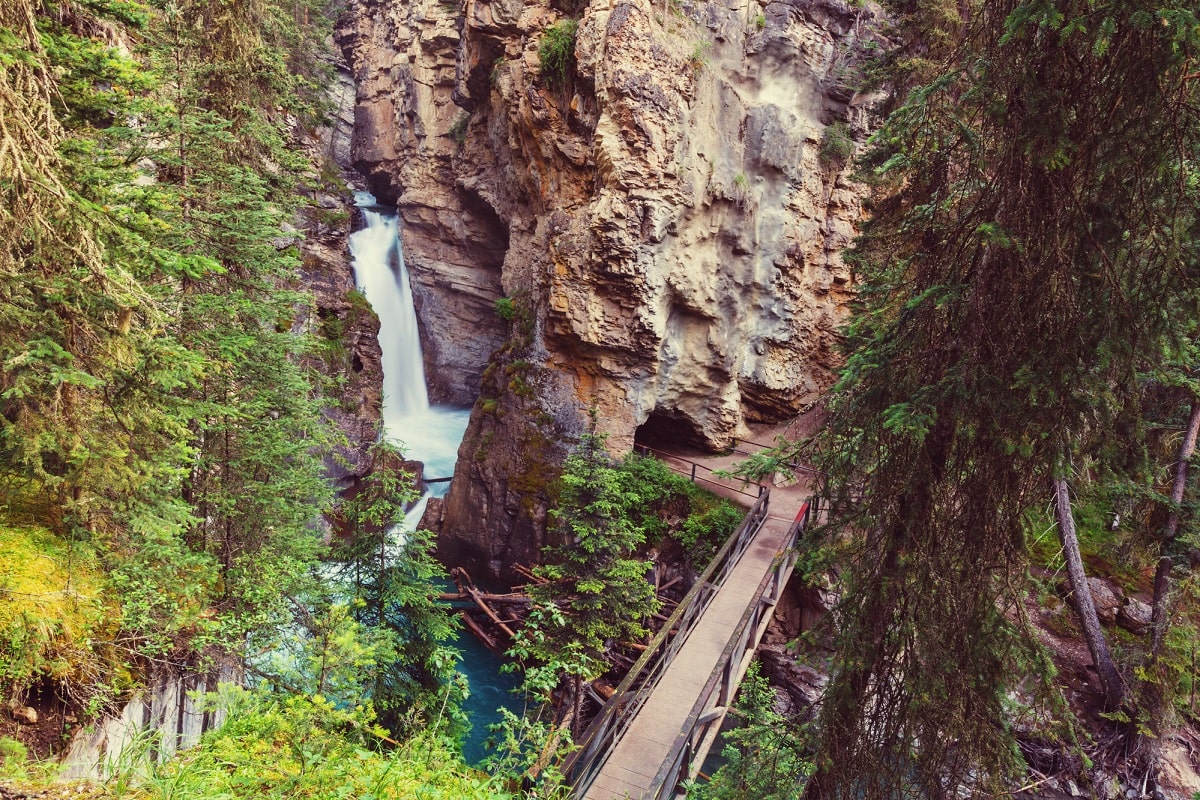view of a bridge and waterfall at Johnston Canyon