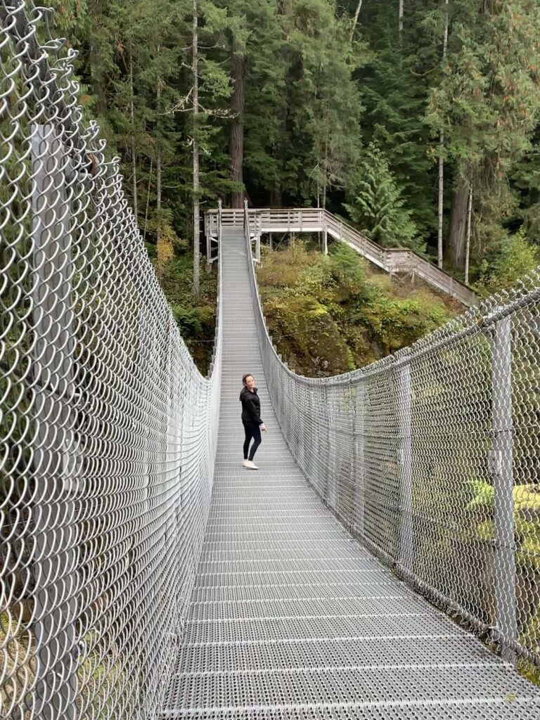 person on the suspension bridge at Elk Falls