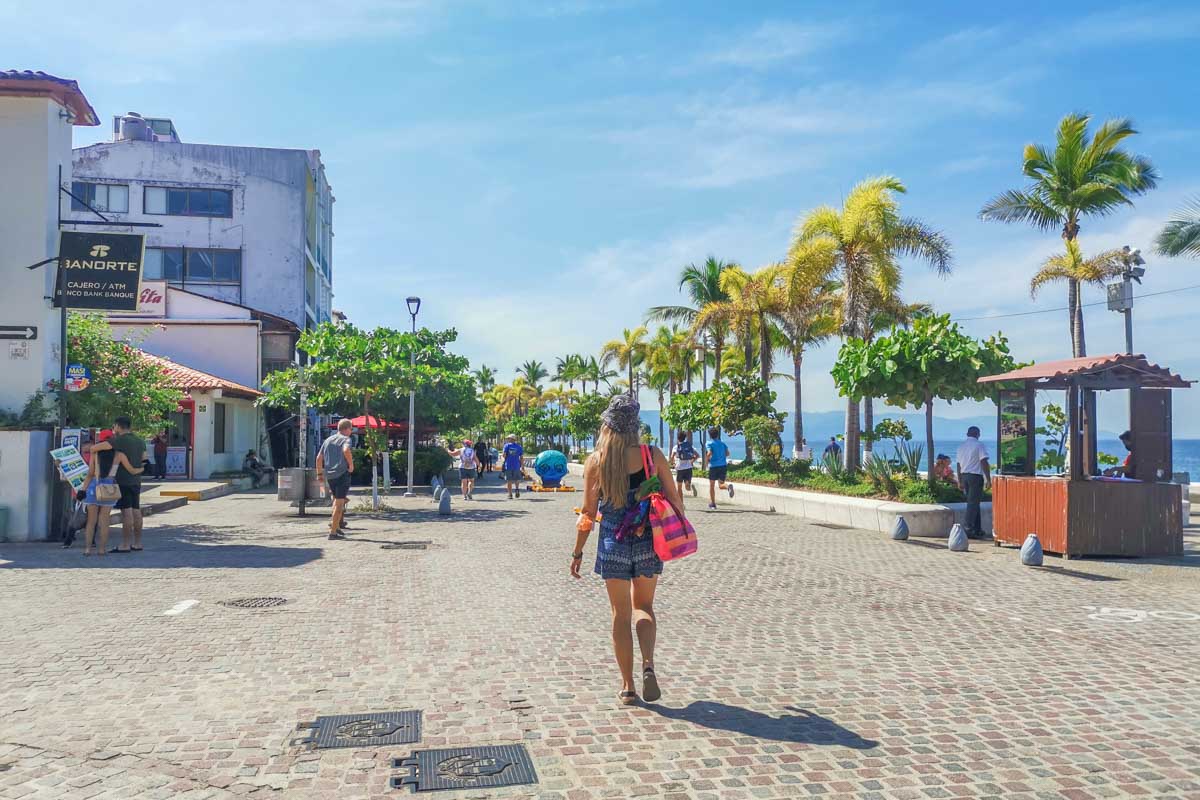 A lady walks along the Puerto Vallarta Malecon