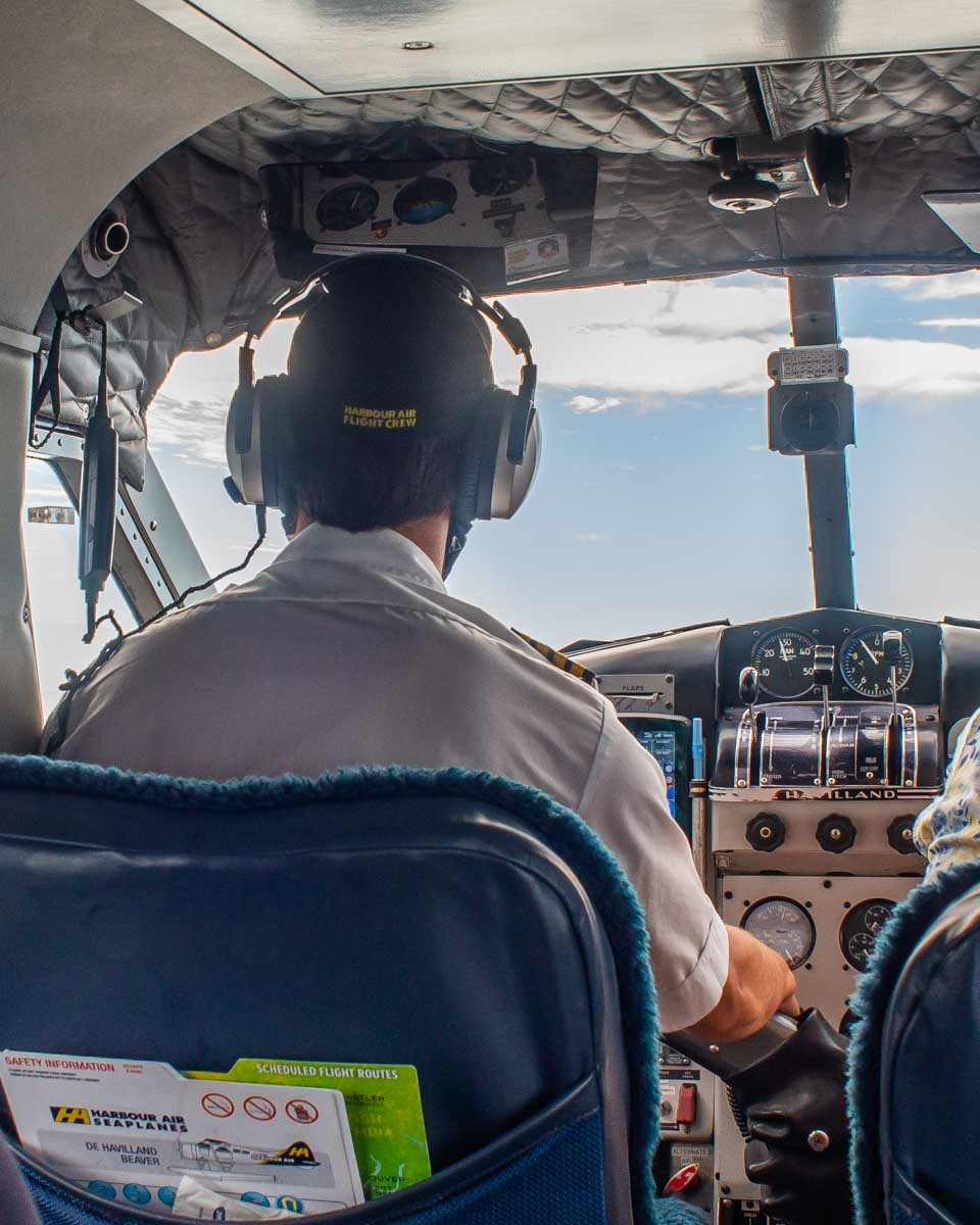 A pilot fly's a plane around Whistler, BC