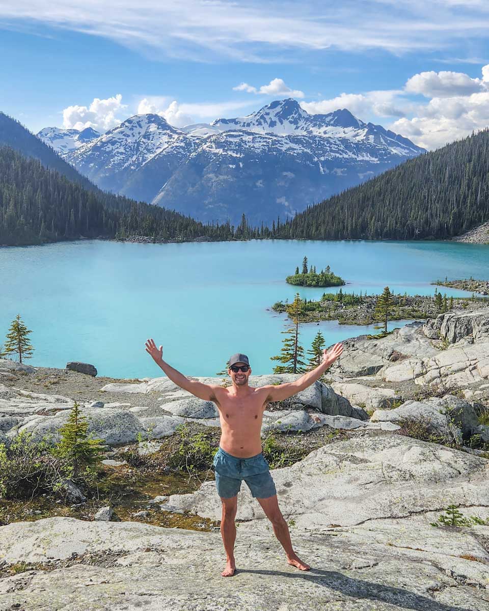 Daniel poses for a photo at Joffre Lakes after a swim