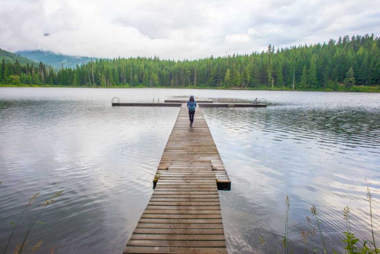 Lady walks on a dock in Whistler
